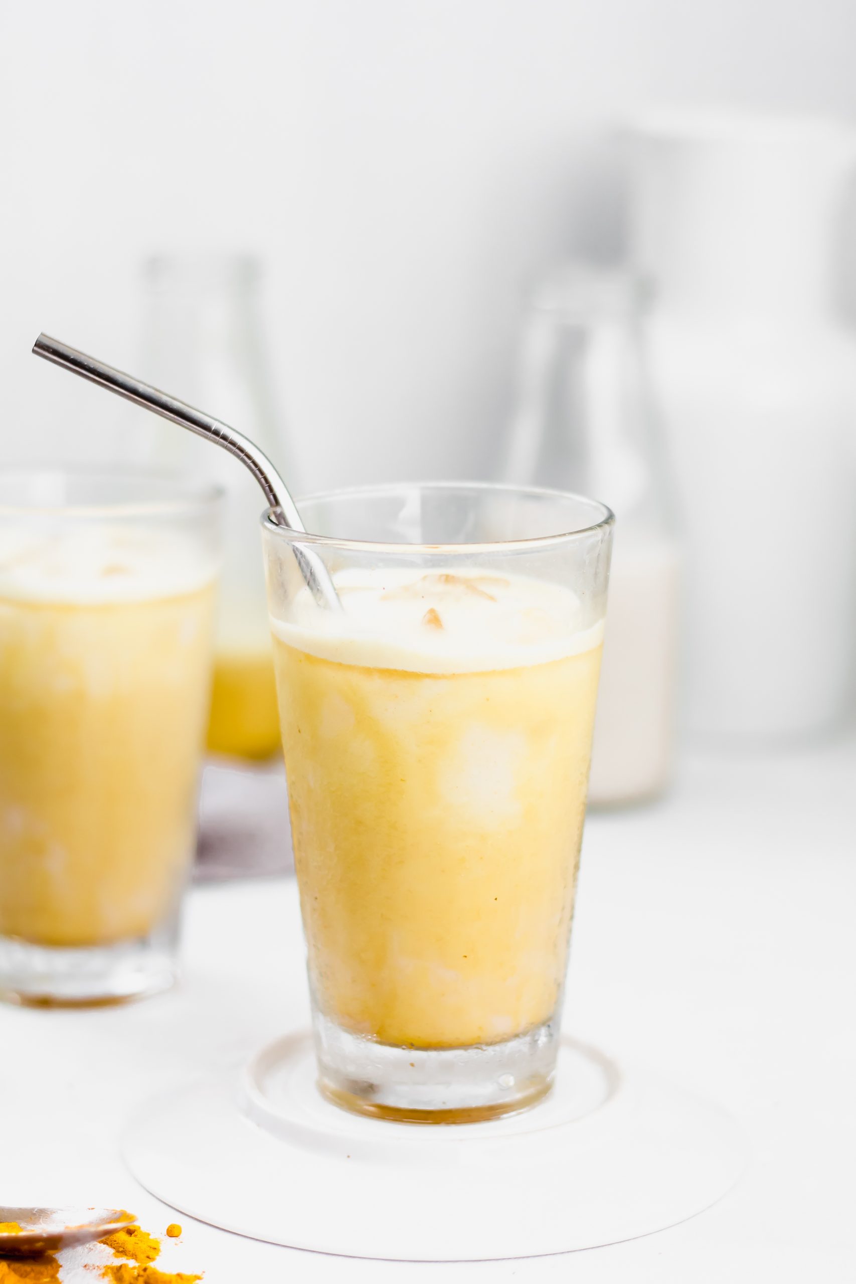 iced golden ginger latte with turmeric, cinnamon, ginger, maple syrup, and coconut milk
