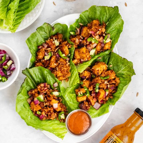 korean bbq tempeh lettuce wraps with onion and rice
