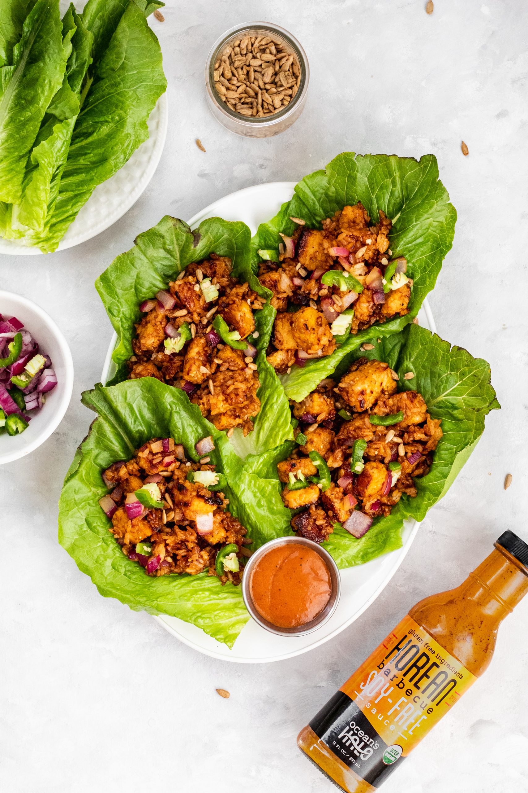 korean bbq tempeh lettuce wraps with onion and rice